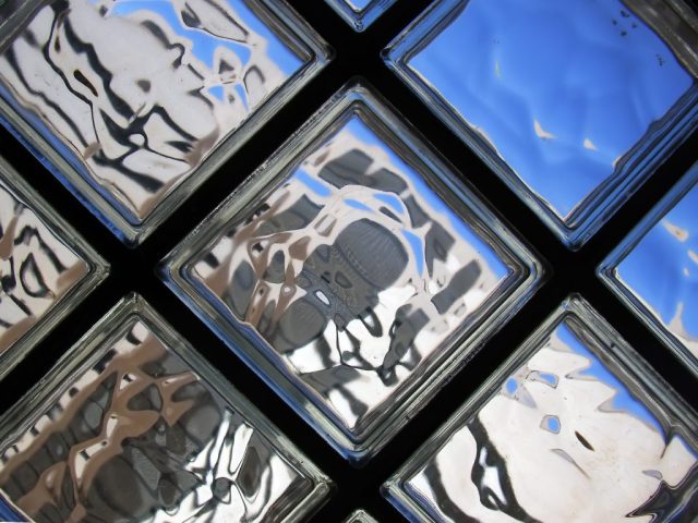 Cityscape as seen trough a glass bricks wall